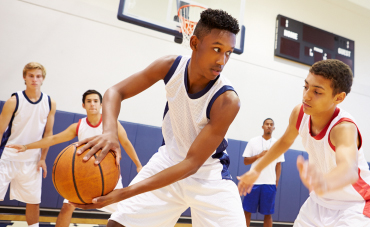 Young boys playing basketball